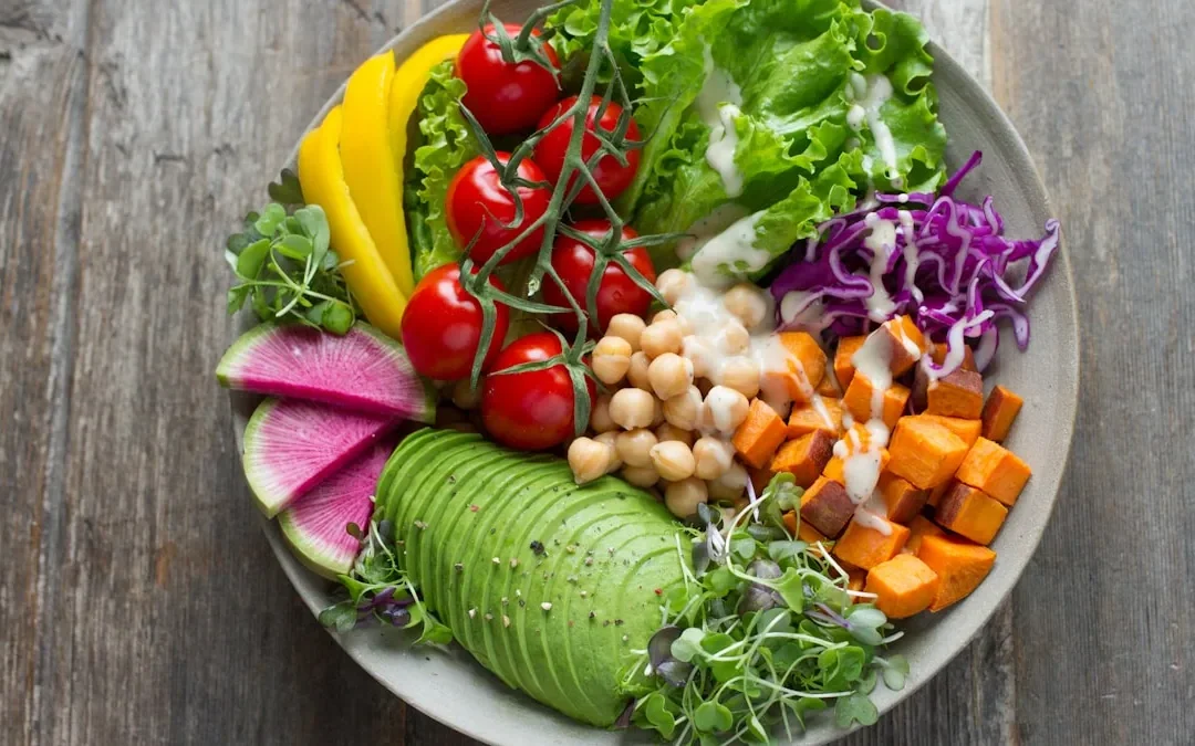 Mediterranean diet foods spread including salmon vegetables nuts and whole grains for menopause nutrition