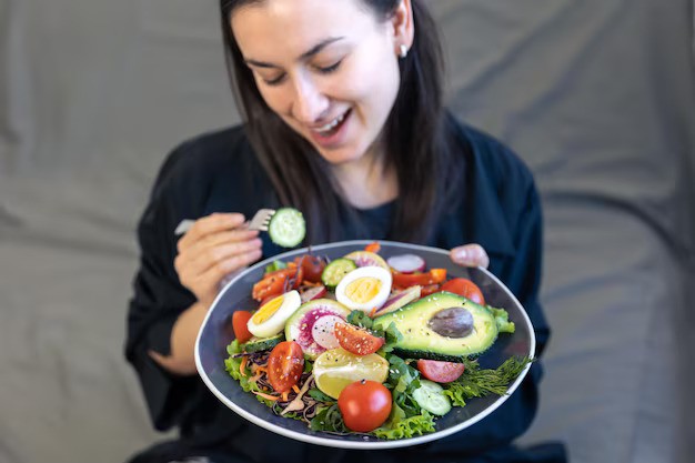 appetizing-salad-with-fresh-vegetables-eggs-plate-female-hands_169016-19498