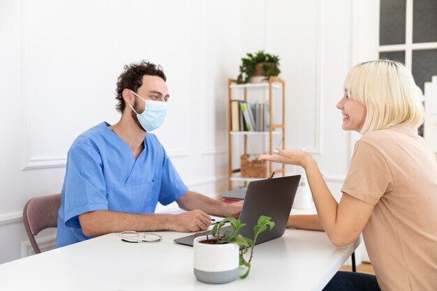 close-up-person-talking-with-doctor-about-vaccination_23-2149118464 (1)