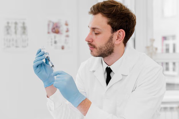 medium-shot-doctor-holding-vial_23-2148868101