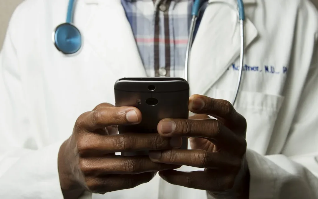 Doctor discussing TRT side effects with male patient in modern telehealth consultation